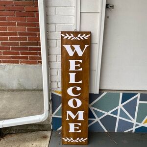 Brown Welcome Sign with White Letters